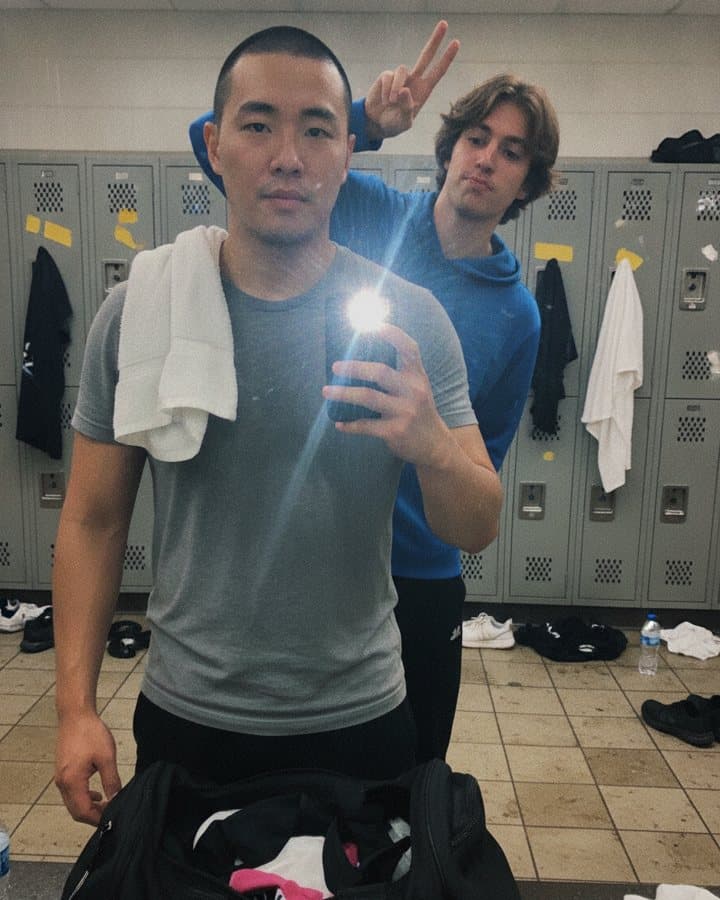 A locker-room mirror selfie with a photobomber